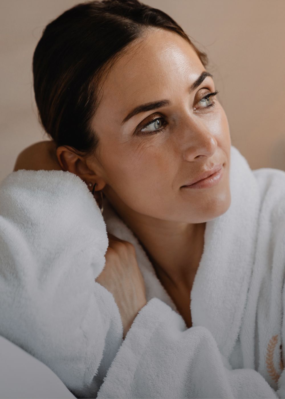 Woman in athletic wear sitting on stairs.